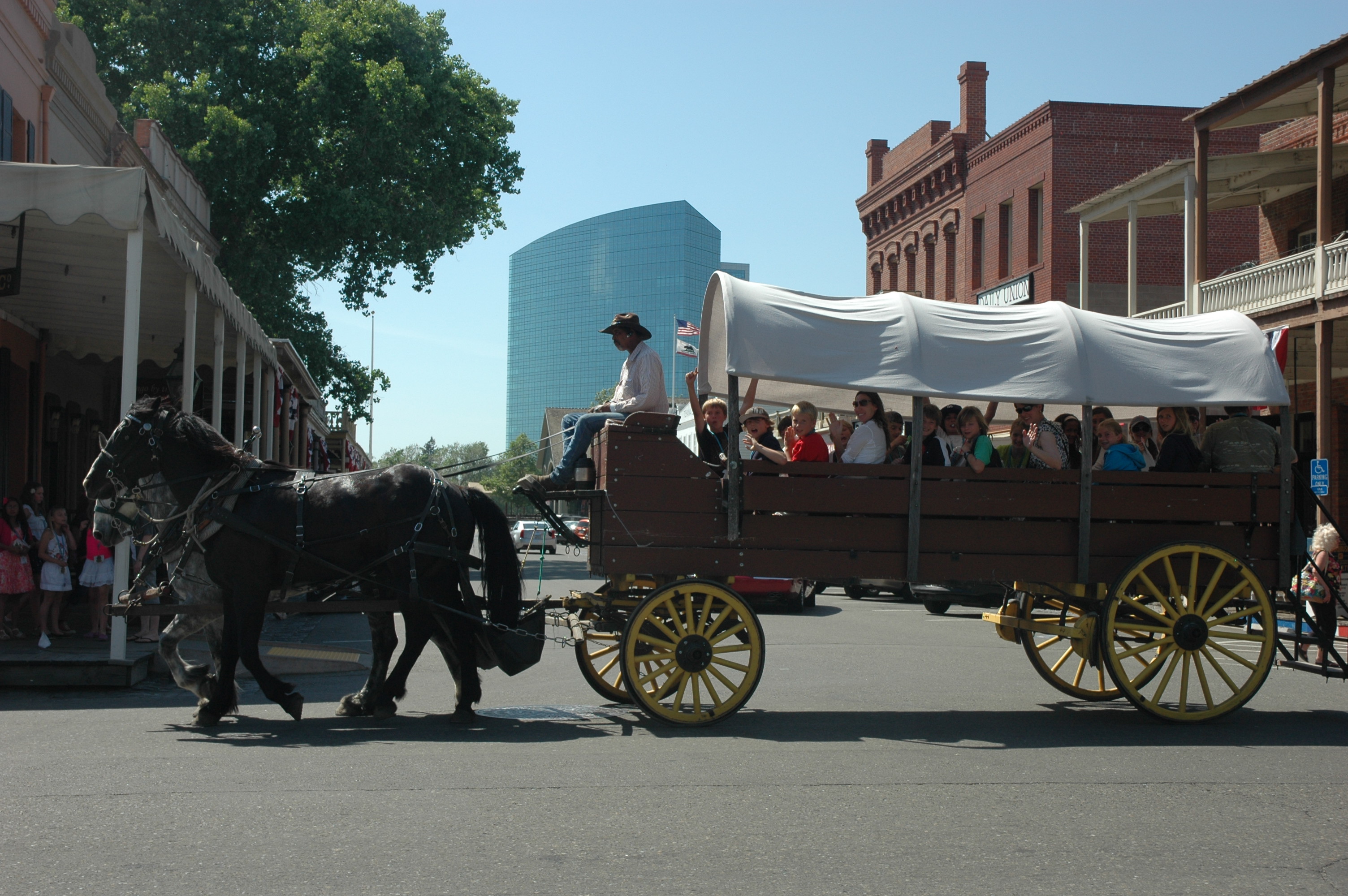 students riding on a horse-drawn wagon on a field trip 